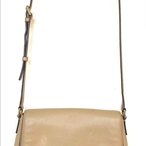 Michael Khor’s beige leather crossbody purse. - Picture 2 of 4